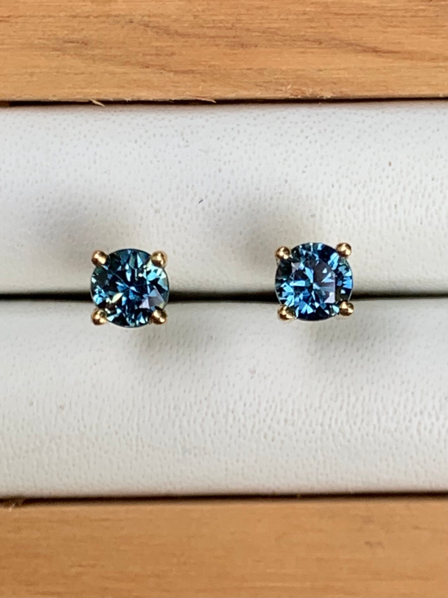 A Pair of Blue Australian Sapphire Stud Earrings set in Yellow Gold