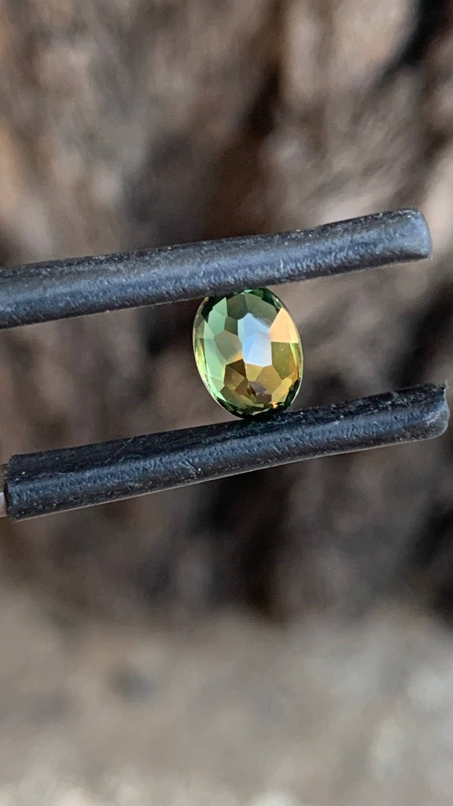 1. Natural Central Queensland sapphire 7.21mm oval green orange parti gemstone