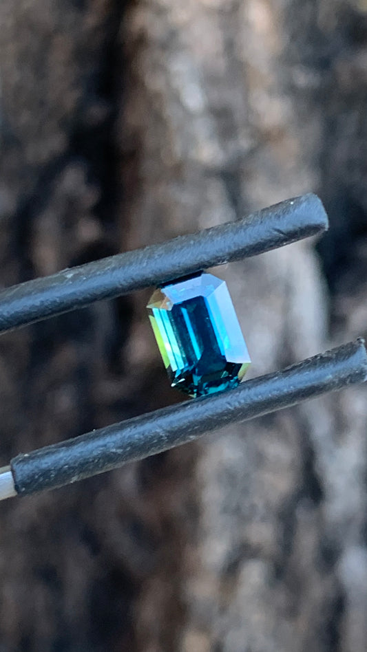 Natural Australian sapphire with rich blue green colour and sleek emerald cut
