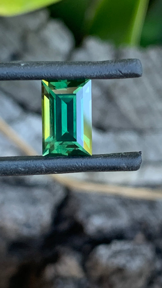 Natural Australian sapphire with deep green colour and sleek baguette cut