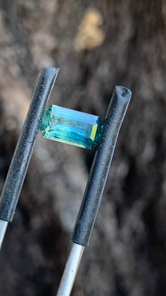 Natural Australian sapphire with teal blue and deep blue colour zoning in an emerald cut