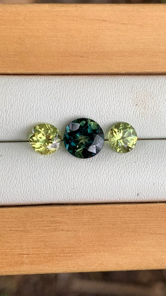 Close up of Blue Parti & Yellow Australian Sapphire Trilogy Set 2.01ct | Betteridge