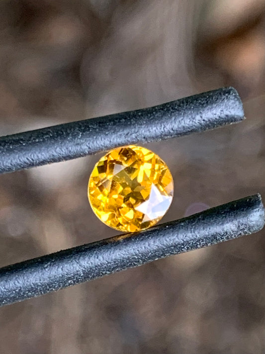 Close-up of a faceted orange sapphire from Australia