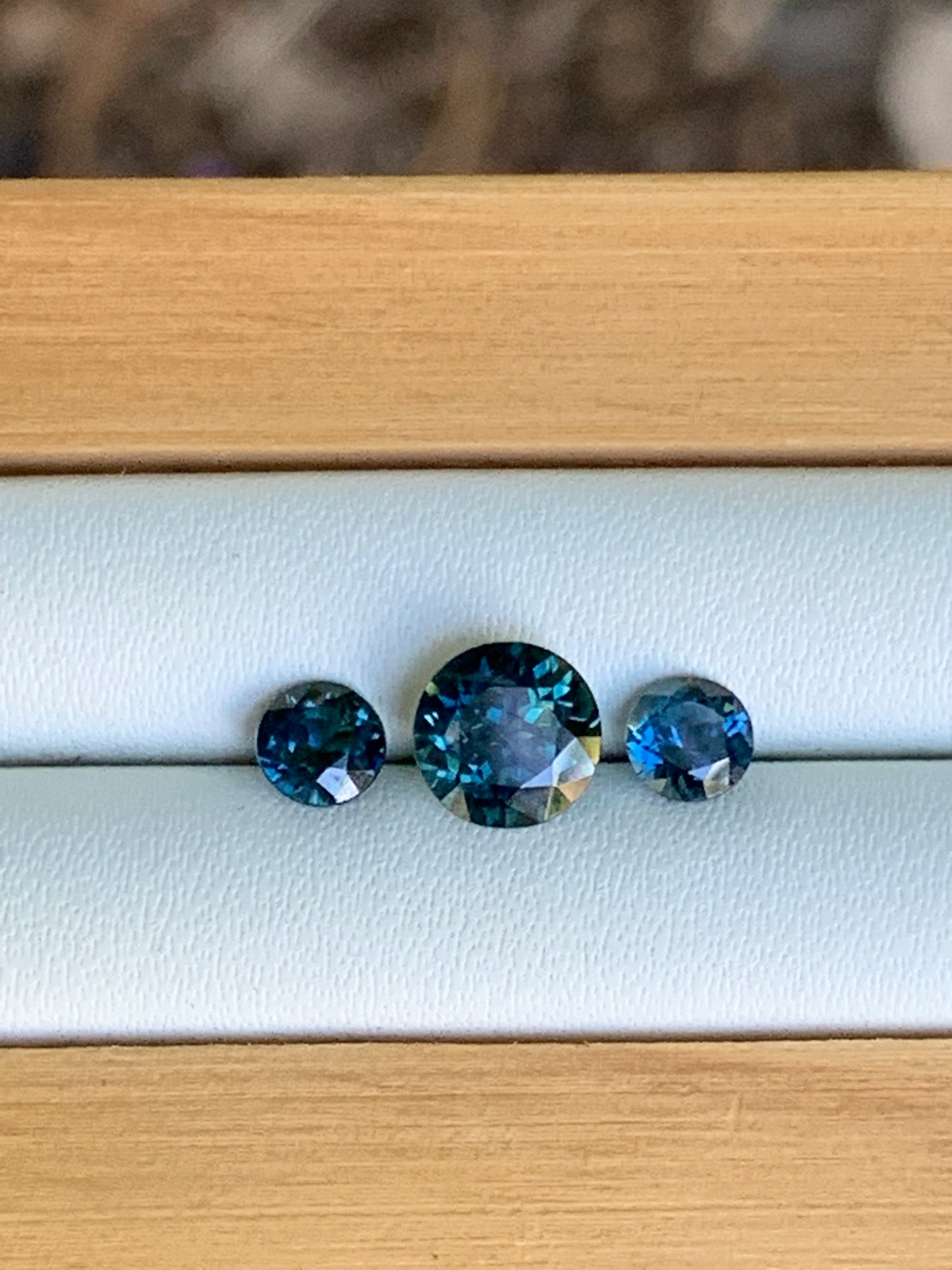 Three unheated blue parti Australian sapphires arranged for a trilogy ring