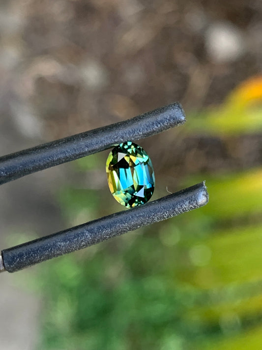 Vibrant unheated Australian sapphire with blue green and yellow tones