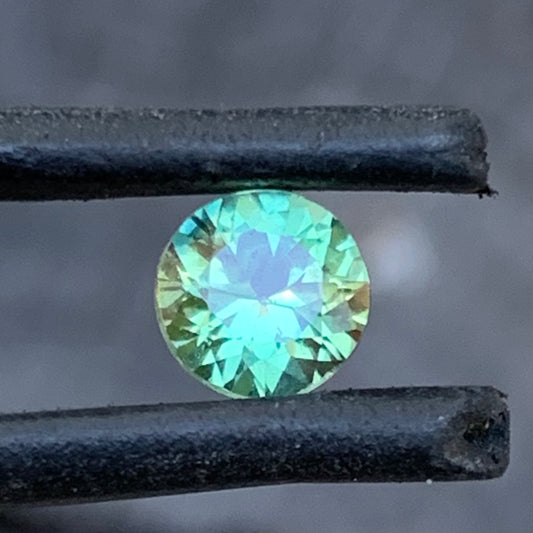 Bright round yellow green Australian parti sapphire from the Central Queensland Gemfields