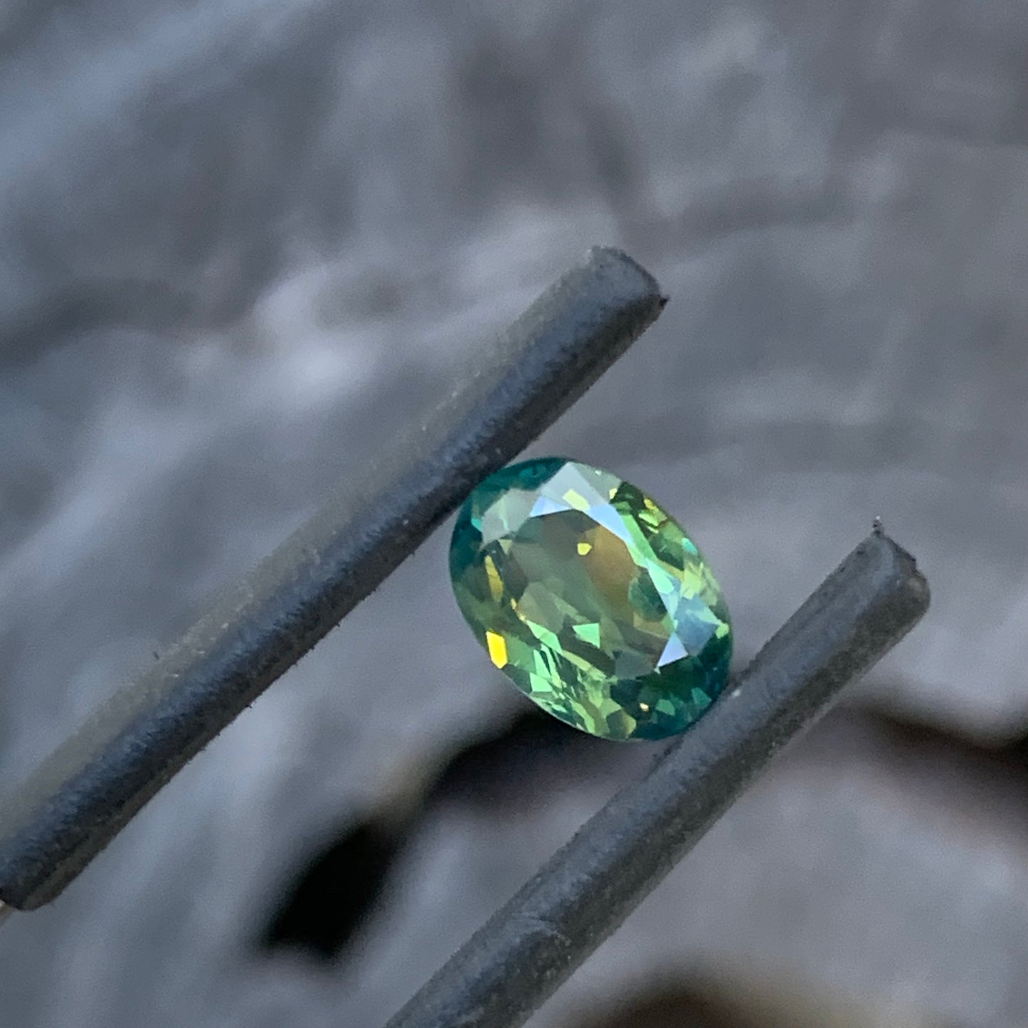 Unique oval Australian sapphire with a luminous teal green appearance
