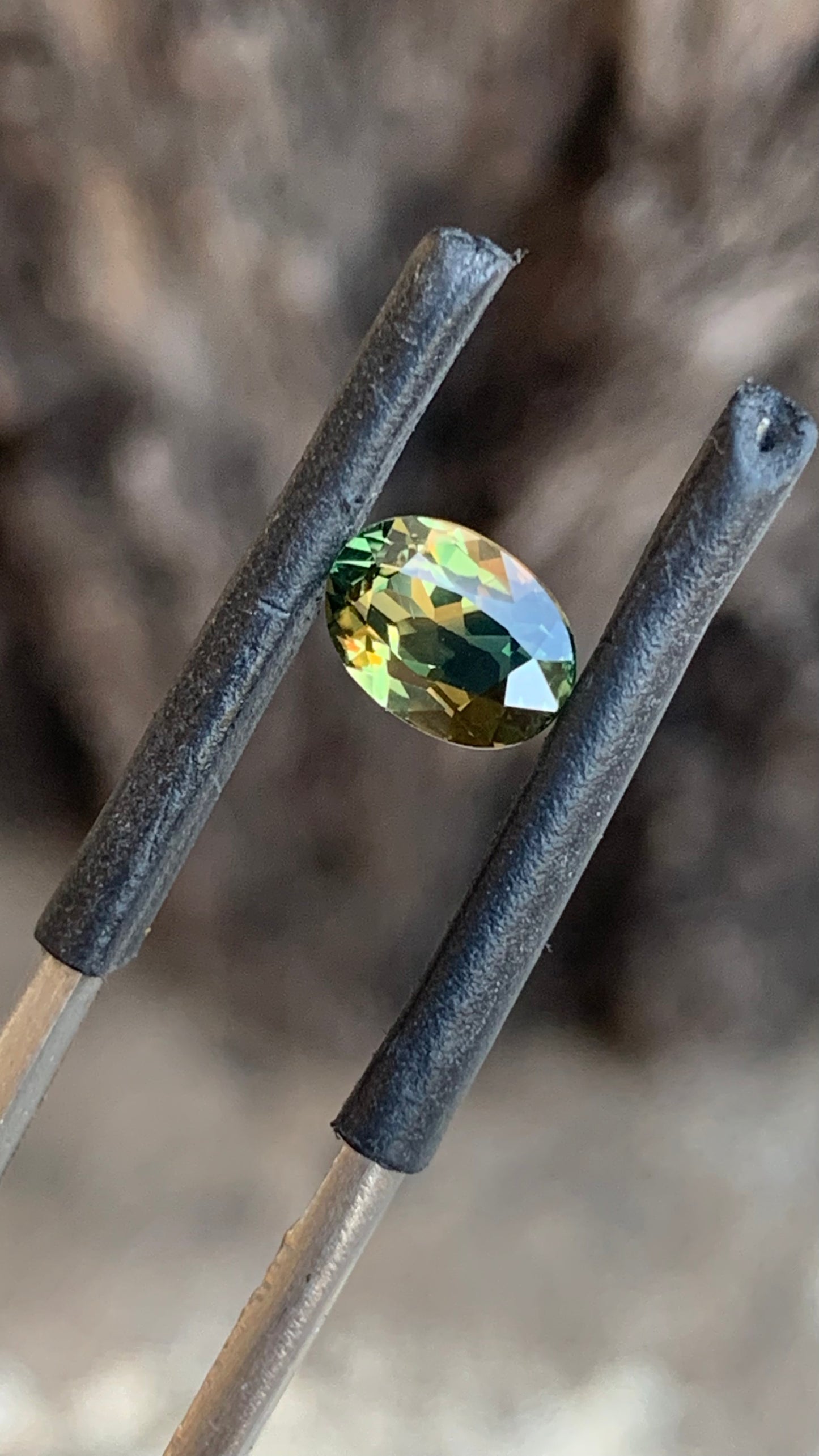 1.25ct heated Australian sapphire with vivid green and orange parti colour