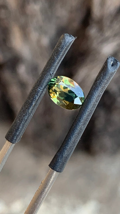 1.25ct heated Australian sapphire with vivid green and orange parti colour