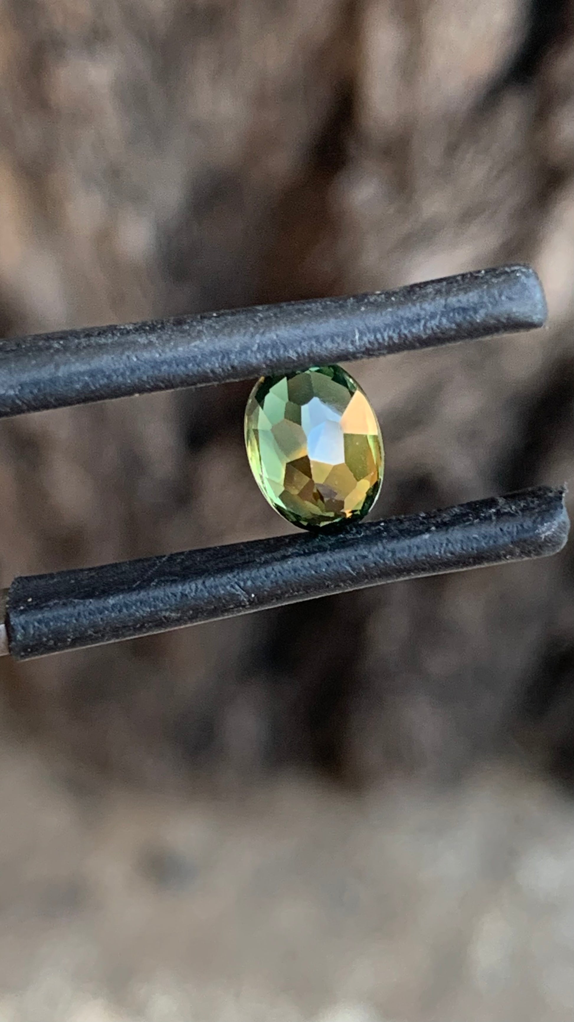 1. Natural Central Queensland sapphire 7.21mm oval green orange parti gemstone