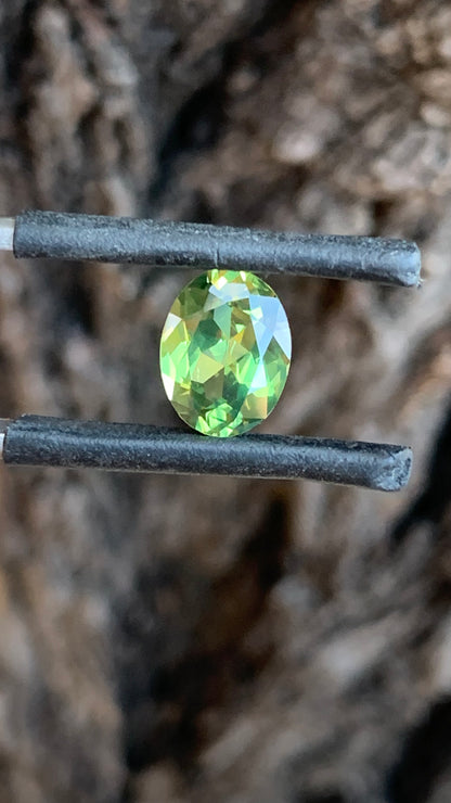 Oval Australian sapphire with vivid green and yellow colour from Central Queensland
