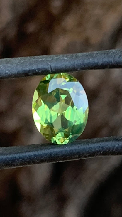 2.51ct green Australian sapphire oval cut with hints of yellow