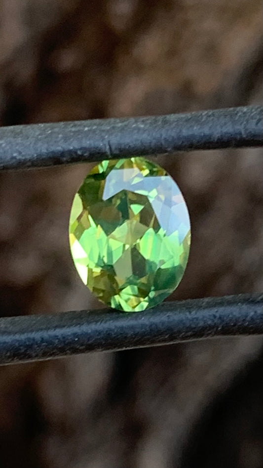 2.51ct green Australian sapphire oval cut with hints of yellow
