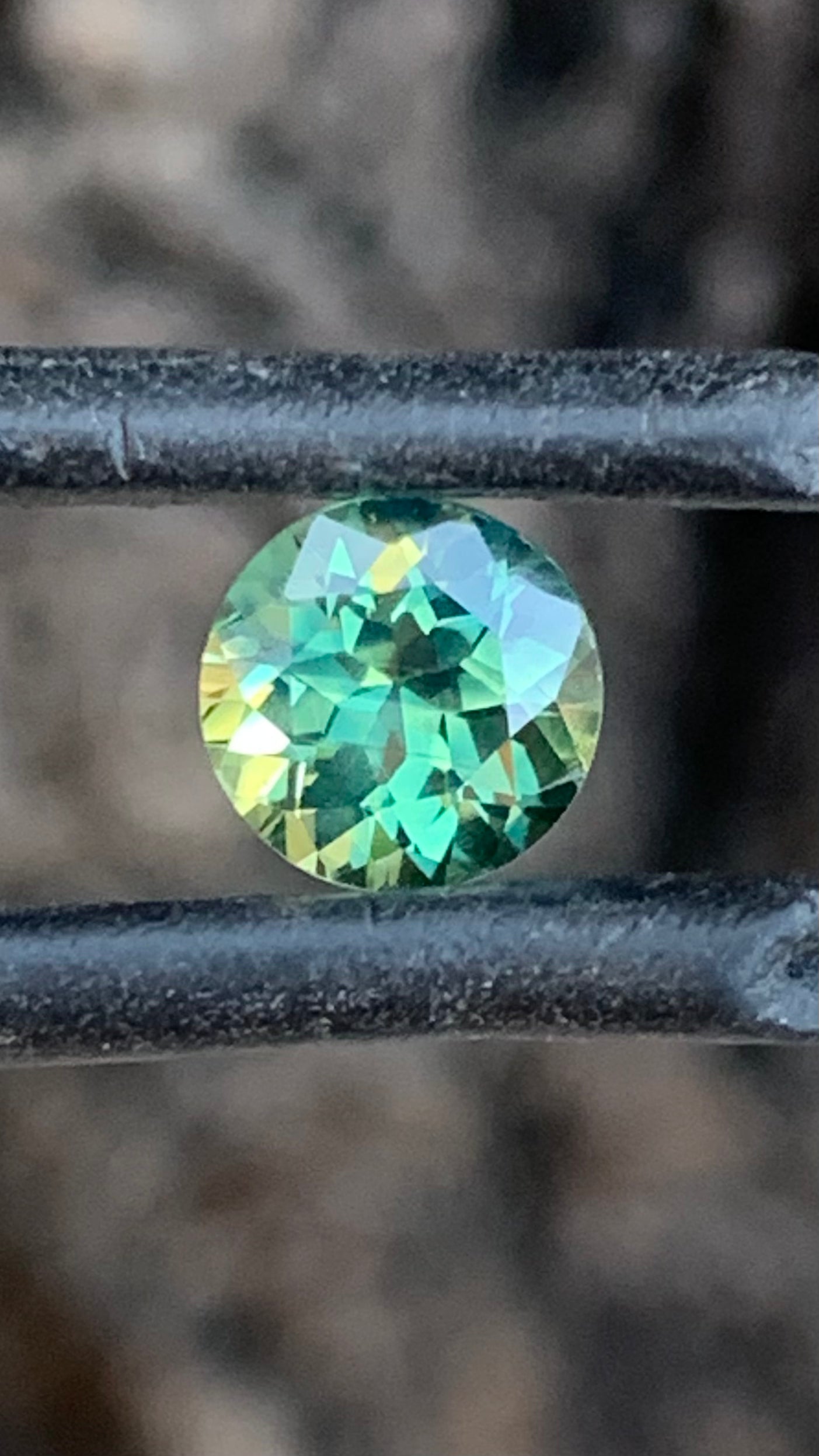 1.16ct eye clean Australian sapphire with green blue and yellow colour zoning