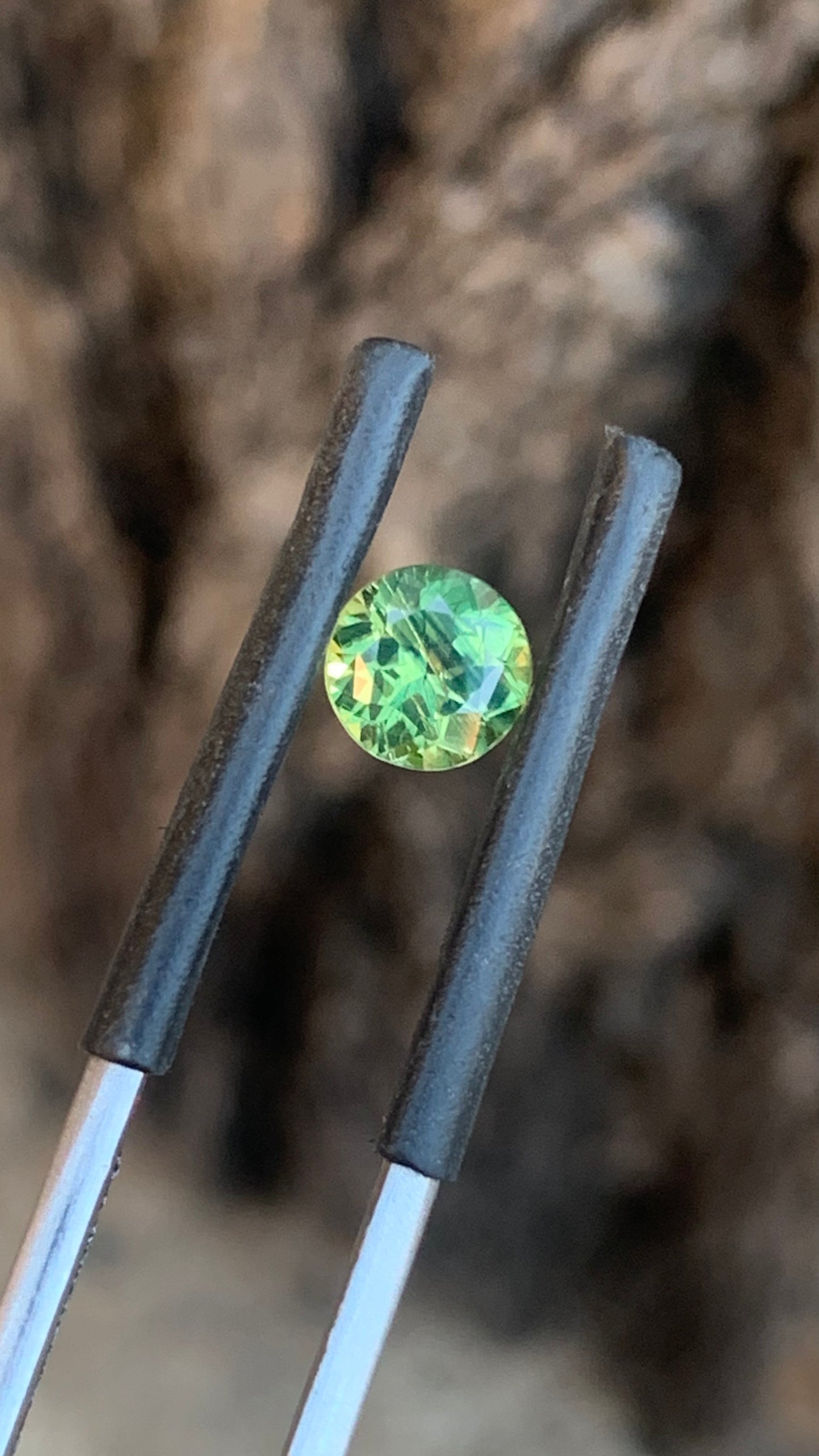 Round Australian sapphire with bright green yellow parti colour from Central Queensland