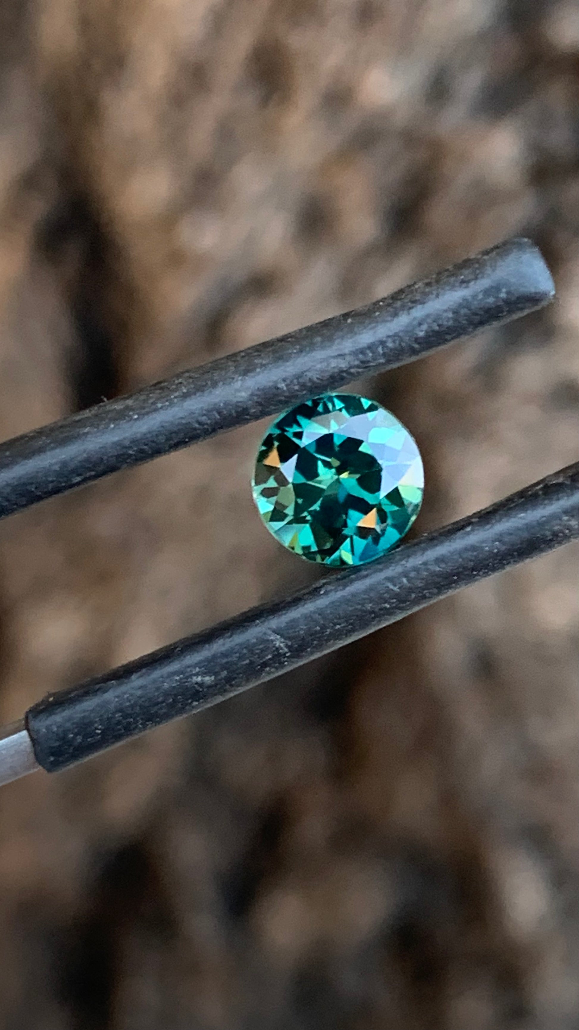Natural Australian teal sapphire with deep saturated colour and round cut