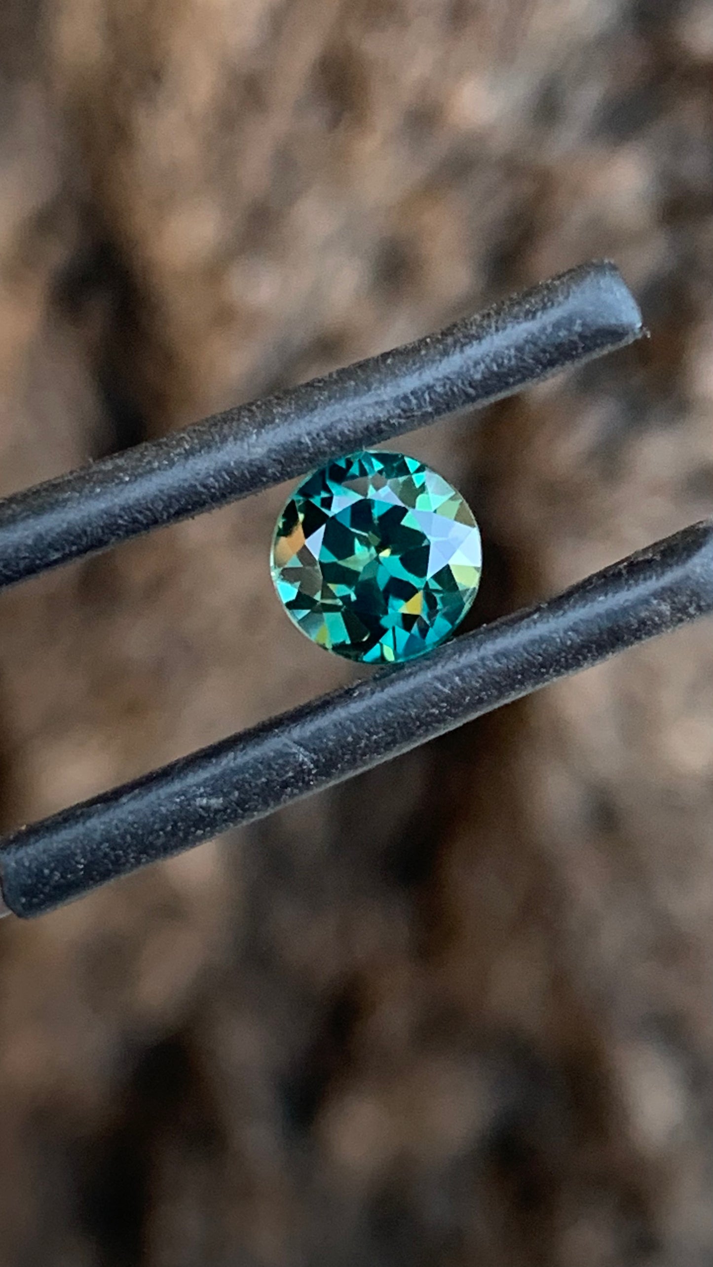 Eye clean round Australian sapphire with rich dark teal colour