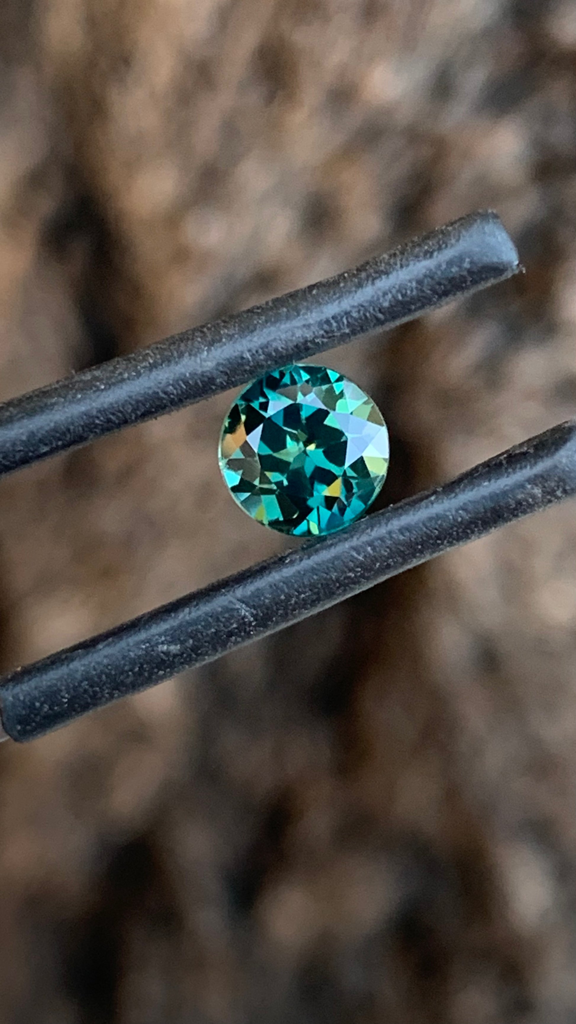 Eye clean round Australian sapphire with rich dark teal colour