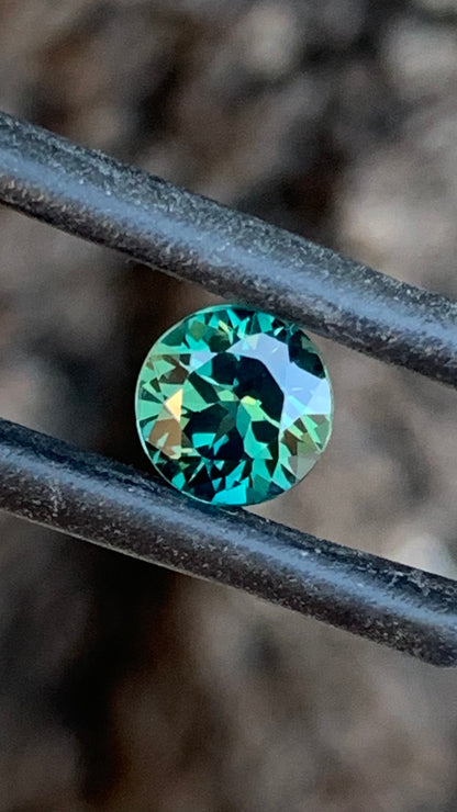 1.01ct dark teal Australian sapphire round cut from the Central Queensland Gemfields
