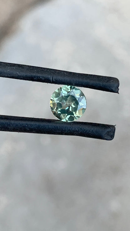 Round Australian sapphire with delicate pastel green blue tones