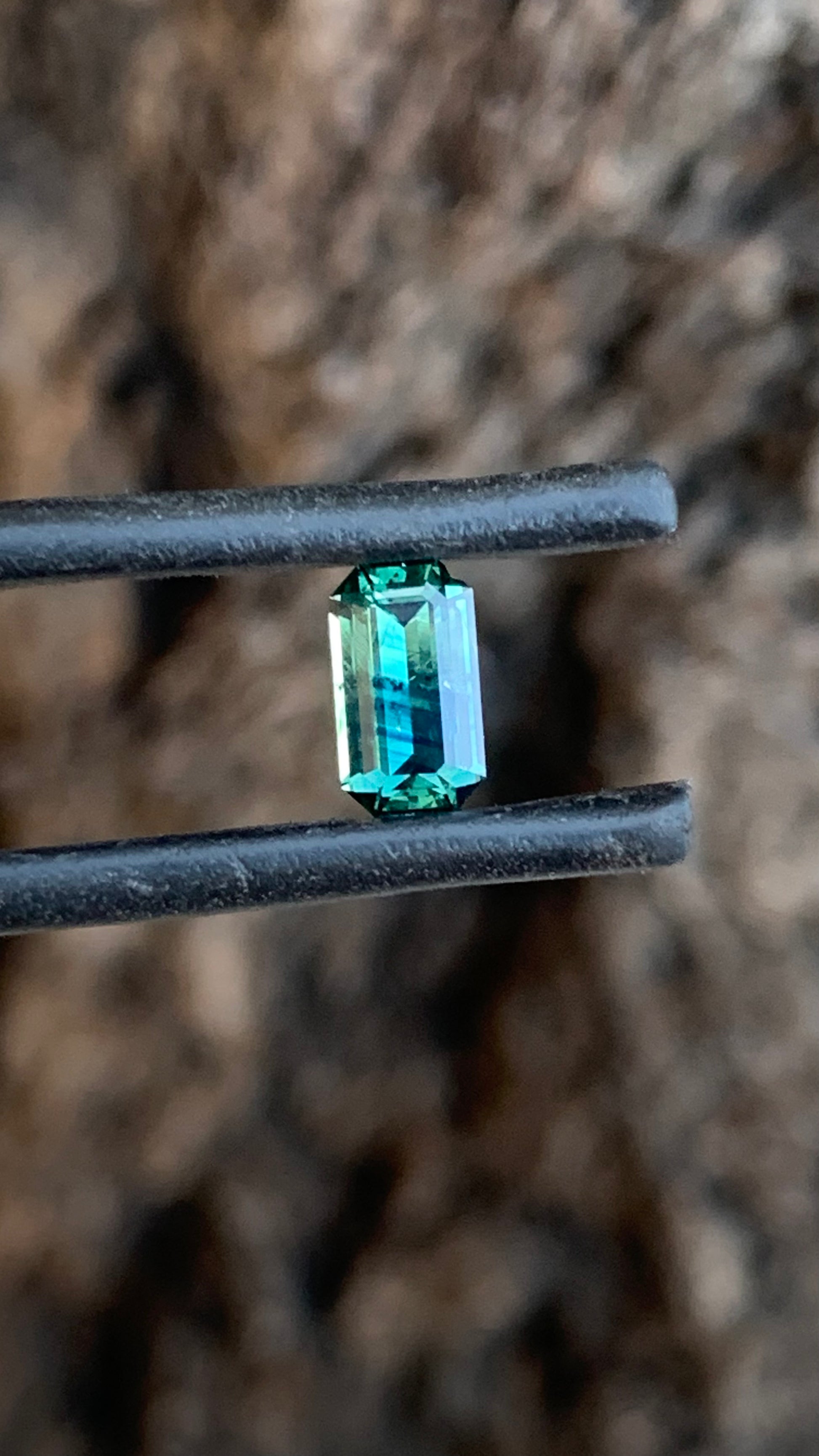 Natural Australian sapphire with unique blue parti stripes and emerald cut