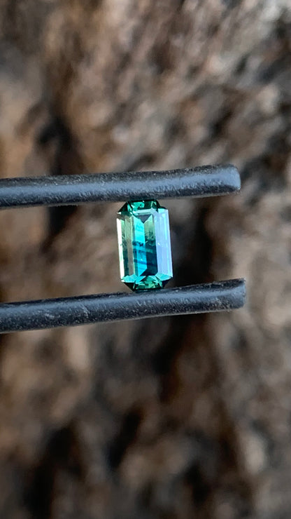 Natural Australian sapphire with unique blue parti stripes and emerald cut