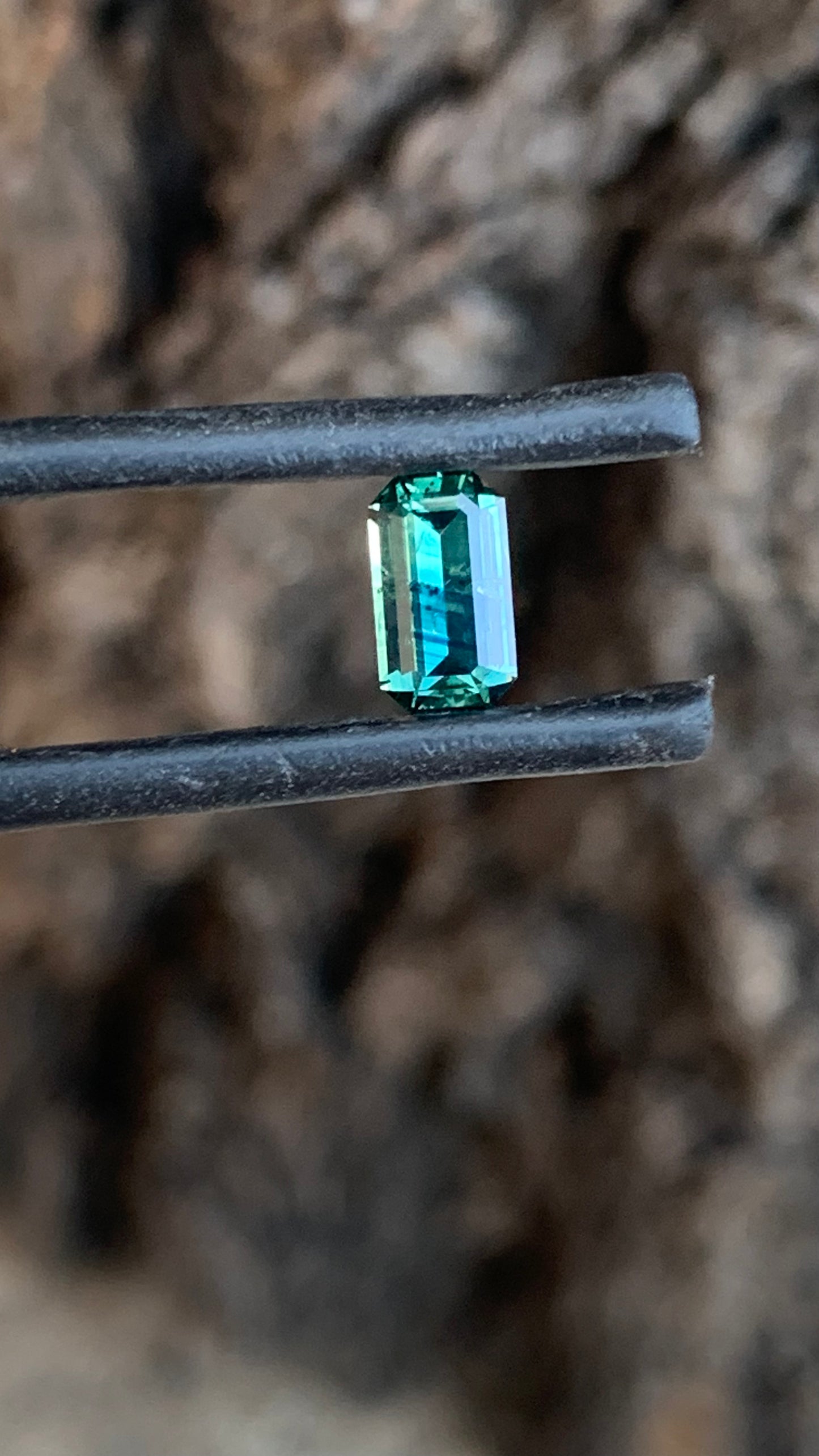 Emerald cut Australian sapphire with distinctive two-tone blue colour pattern