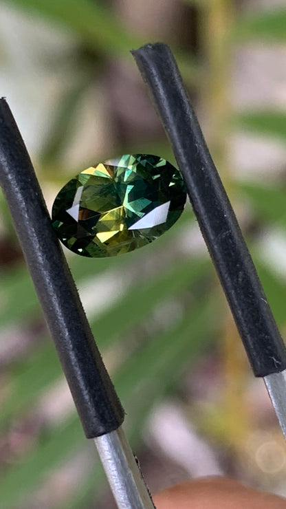 Natural Australian parti sapphire with bright green yellow and blue colour zoning