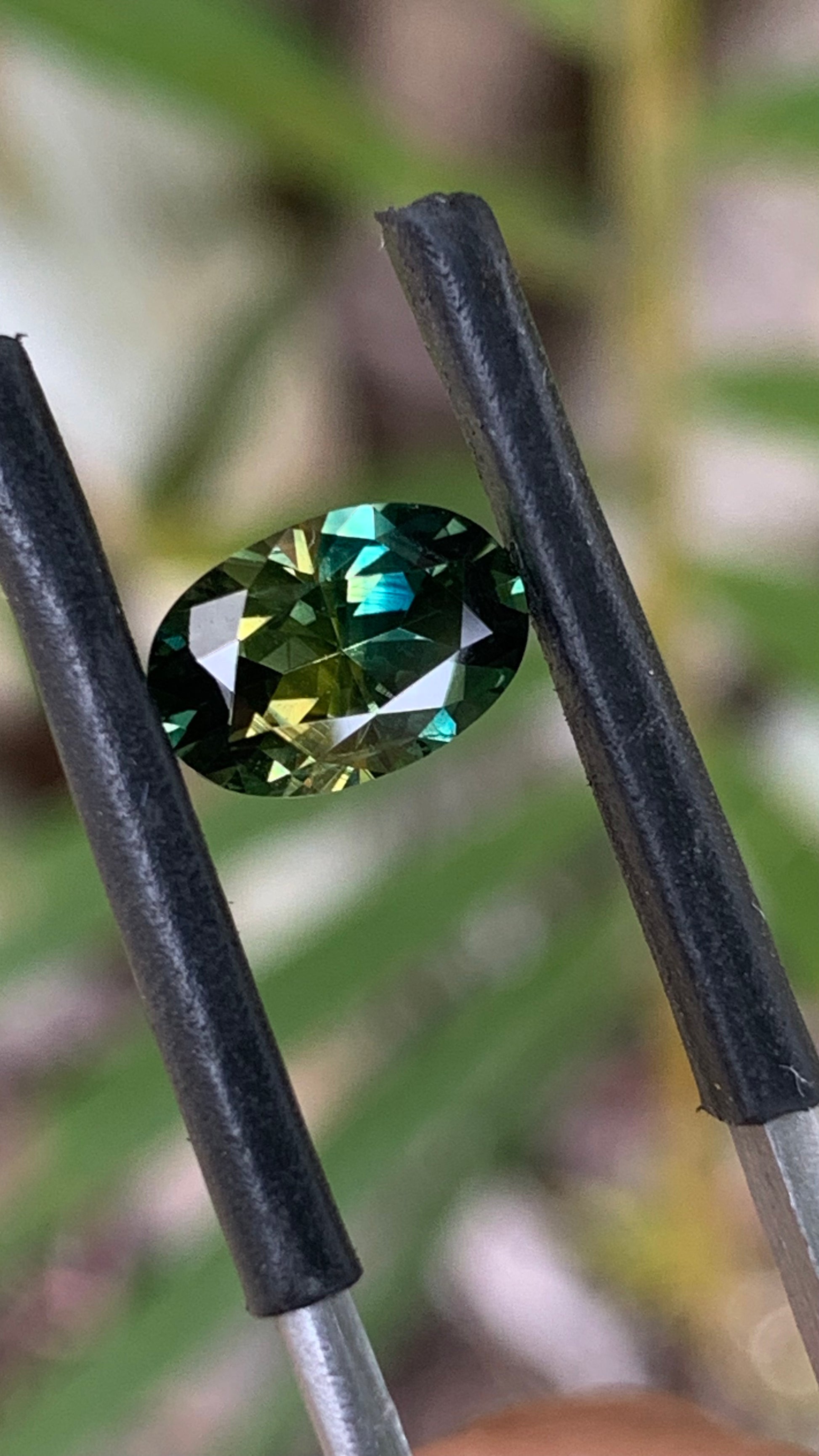 1.89ct eye clean Australian sapphire with green blue and yellow colour play