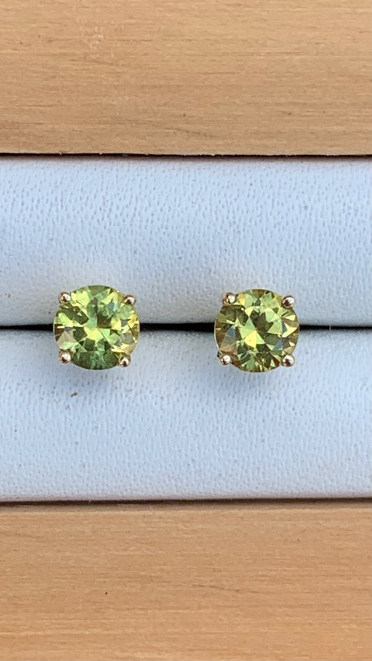 Yellow green Australian sapphire stud earrings set in yellow gold