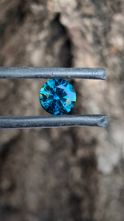 Round Australian sapphire with moody saturated blue tones