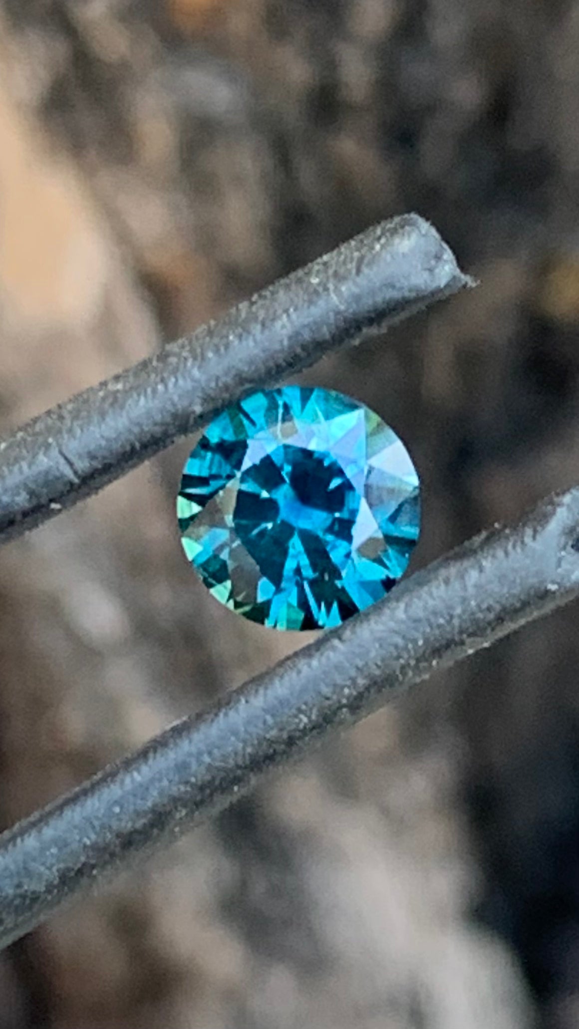 Round Australian sapphire with rich blue colour and lively sparkle