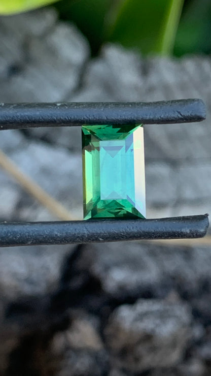Eye clean baguette cut Australian sapphire with rich earthy green tones