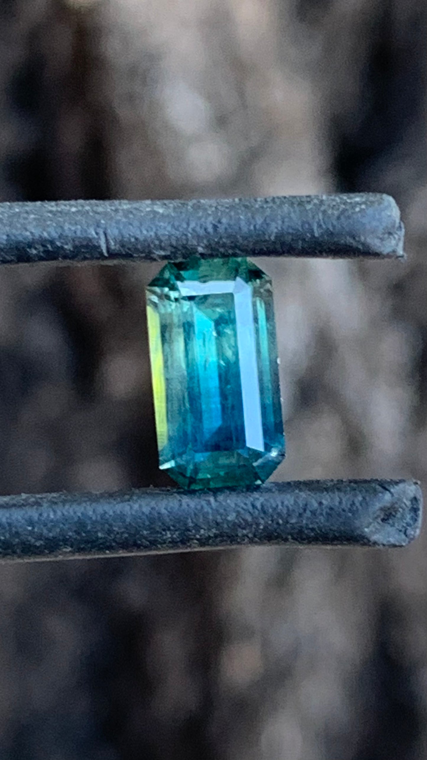 1.505ct blue parti Australian sapphire emerald cut graduating from teal blue to rich blue
