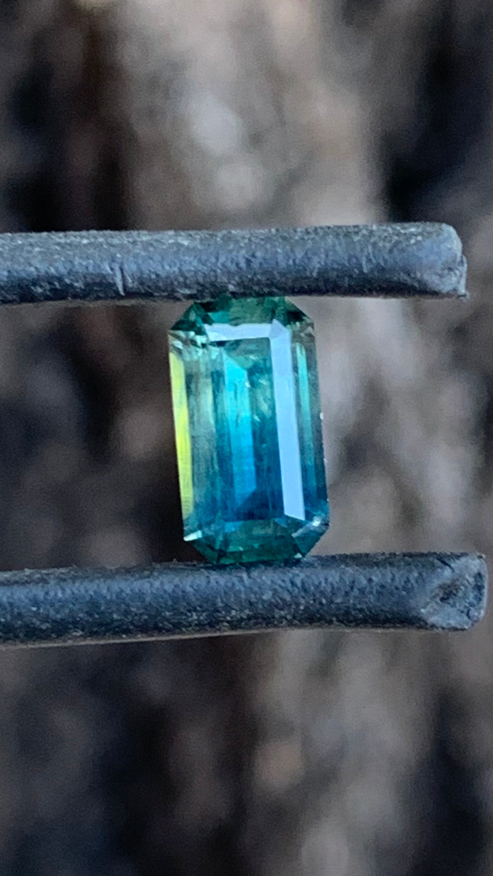 1.505ct blue parti Australian sapphire emerald cut graduating from teal blue to rich blue