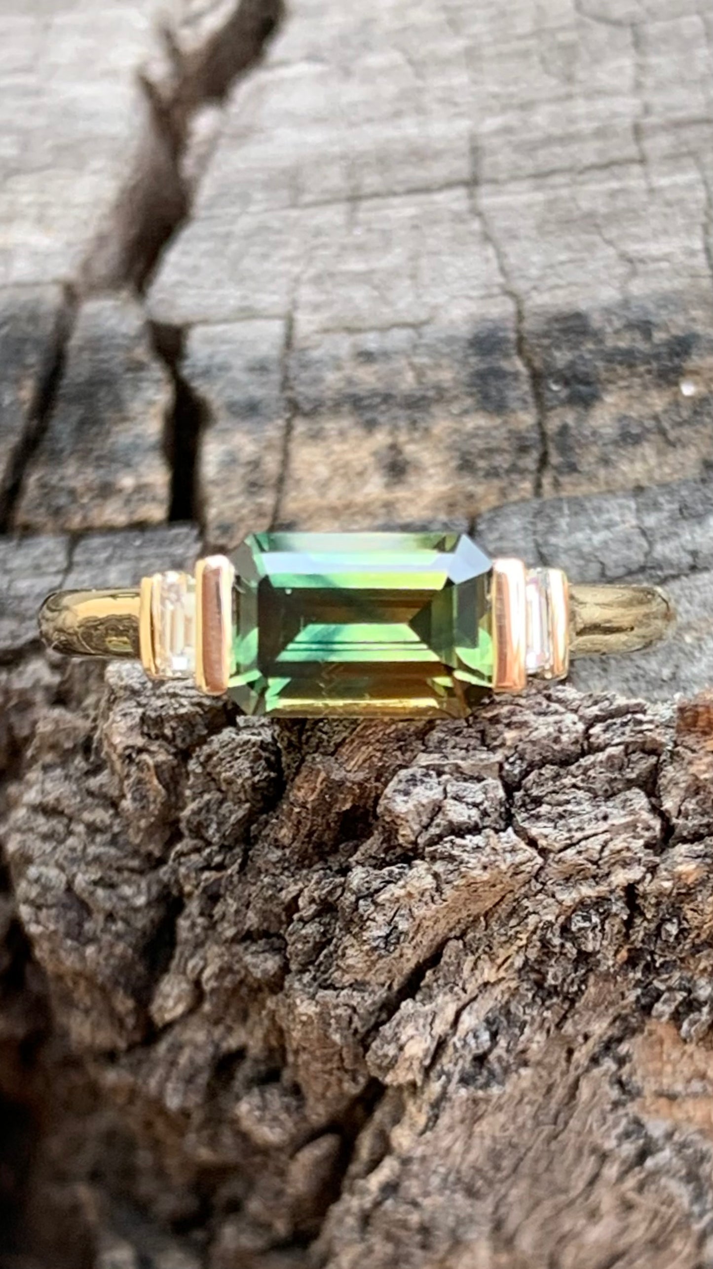 Emerald Cut Sapphire Ring with baguette diamond accents