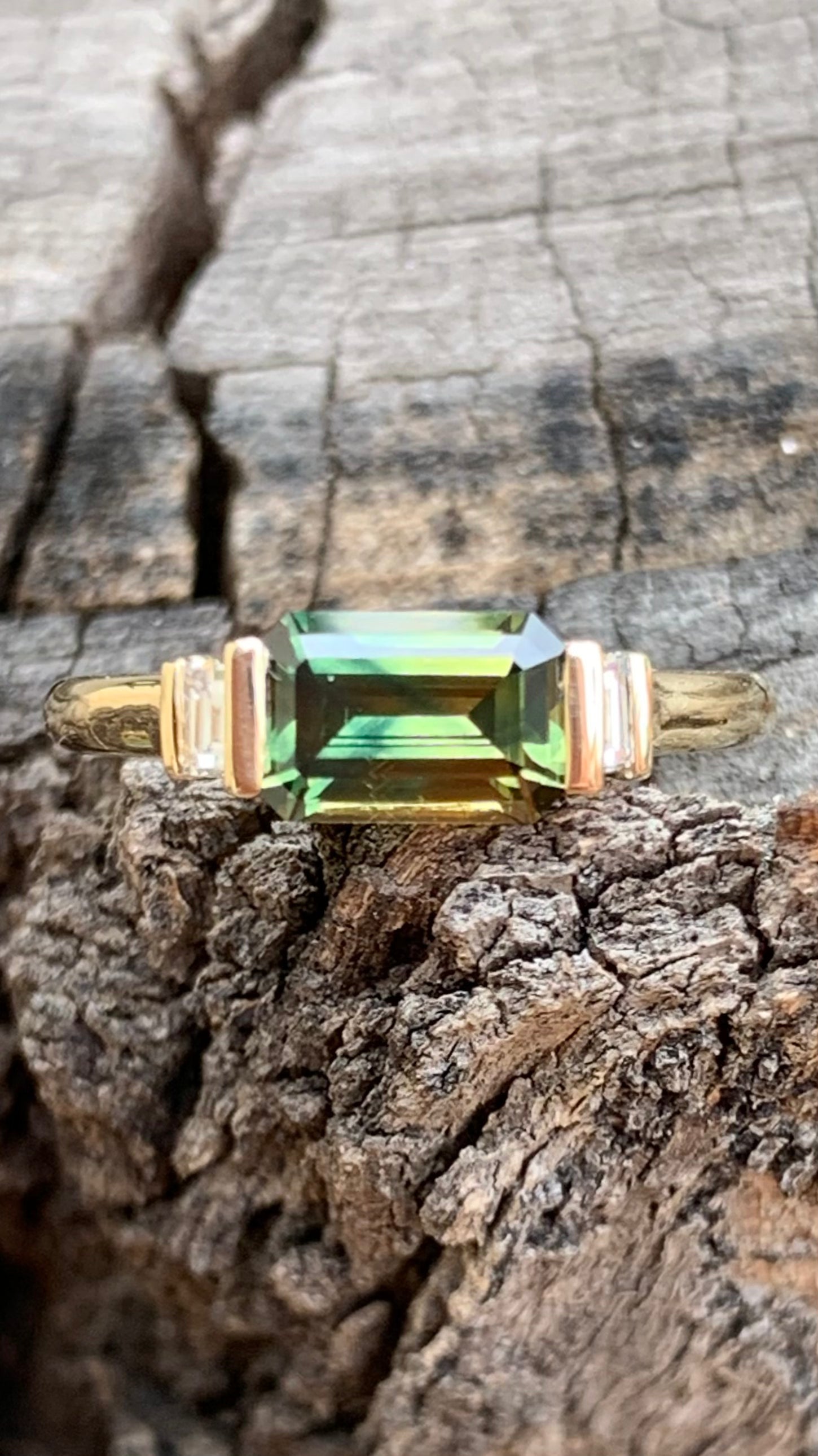 Emerald Cut Sapphire Ring with baguette diamond accents