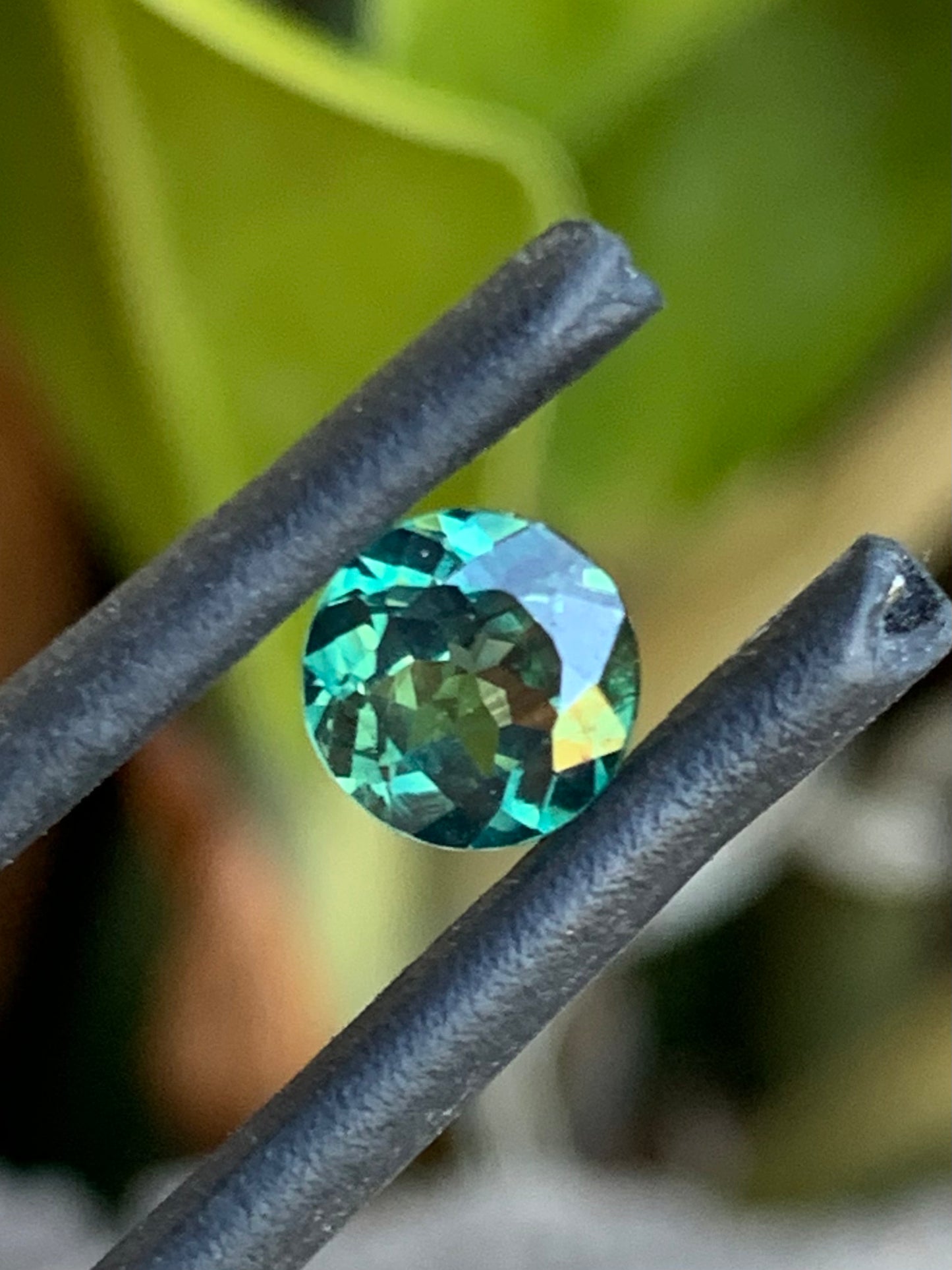Teal parti sapphire with natural colour zoning