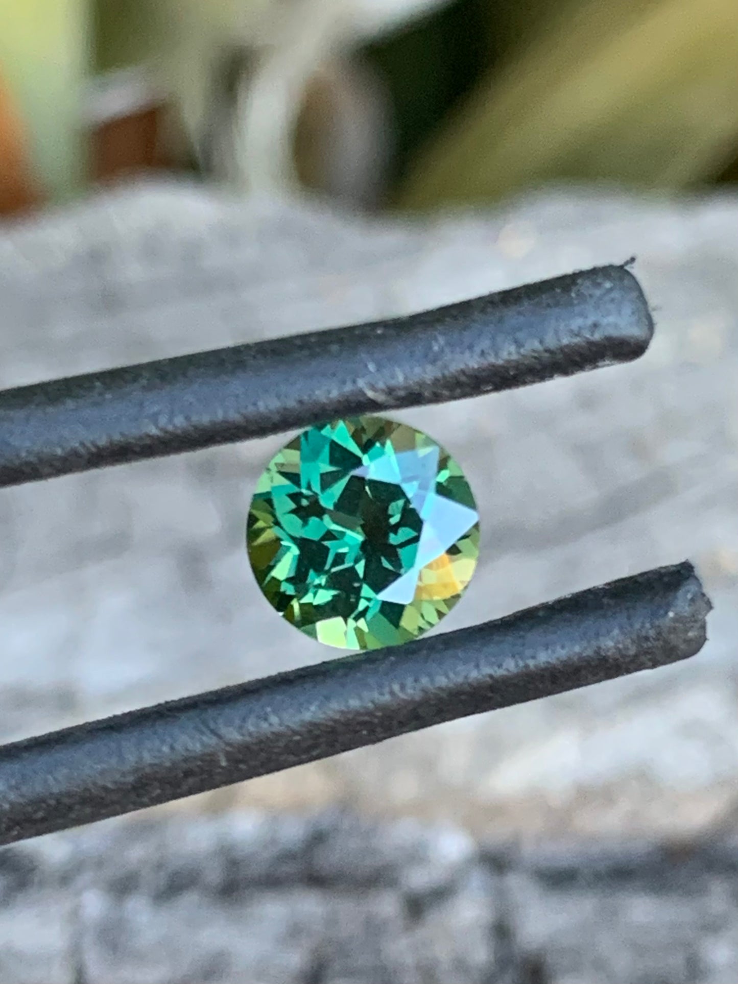 1.09ct green Australian sapphire in a round cut