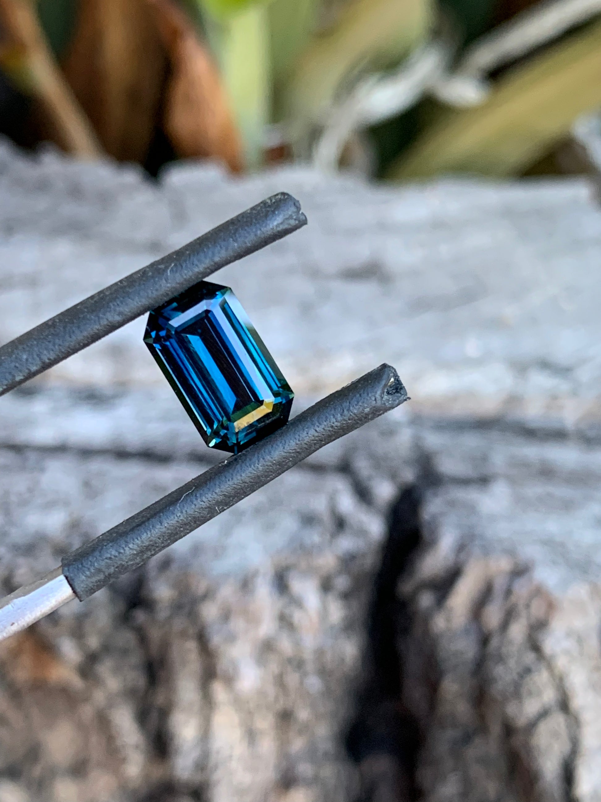 Emerald cut Australian sapphire with deep blue tones