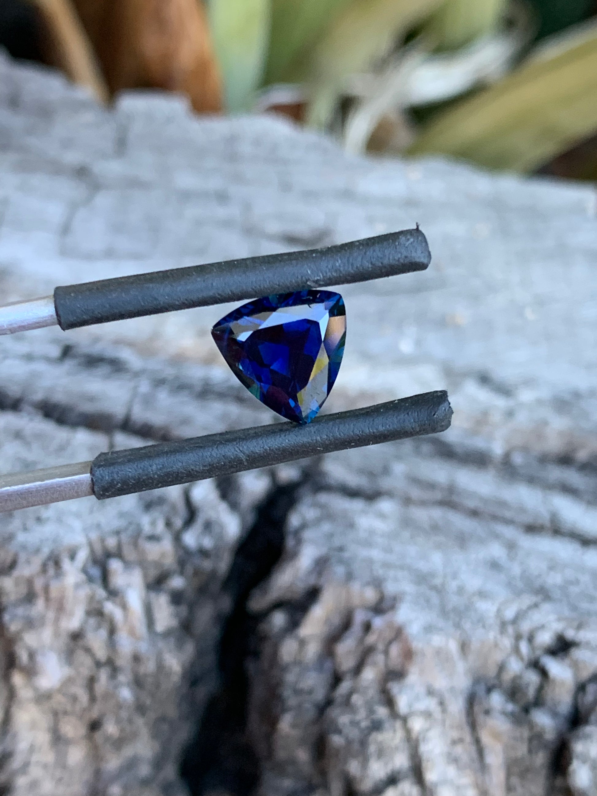 2.23ct royal blue sapphire showcasing sharp trillion facets and depth of colour