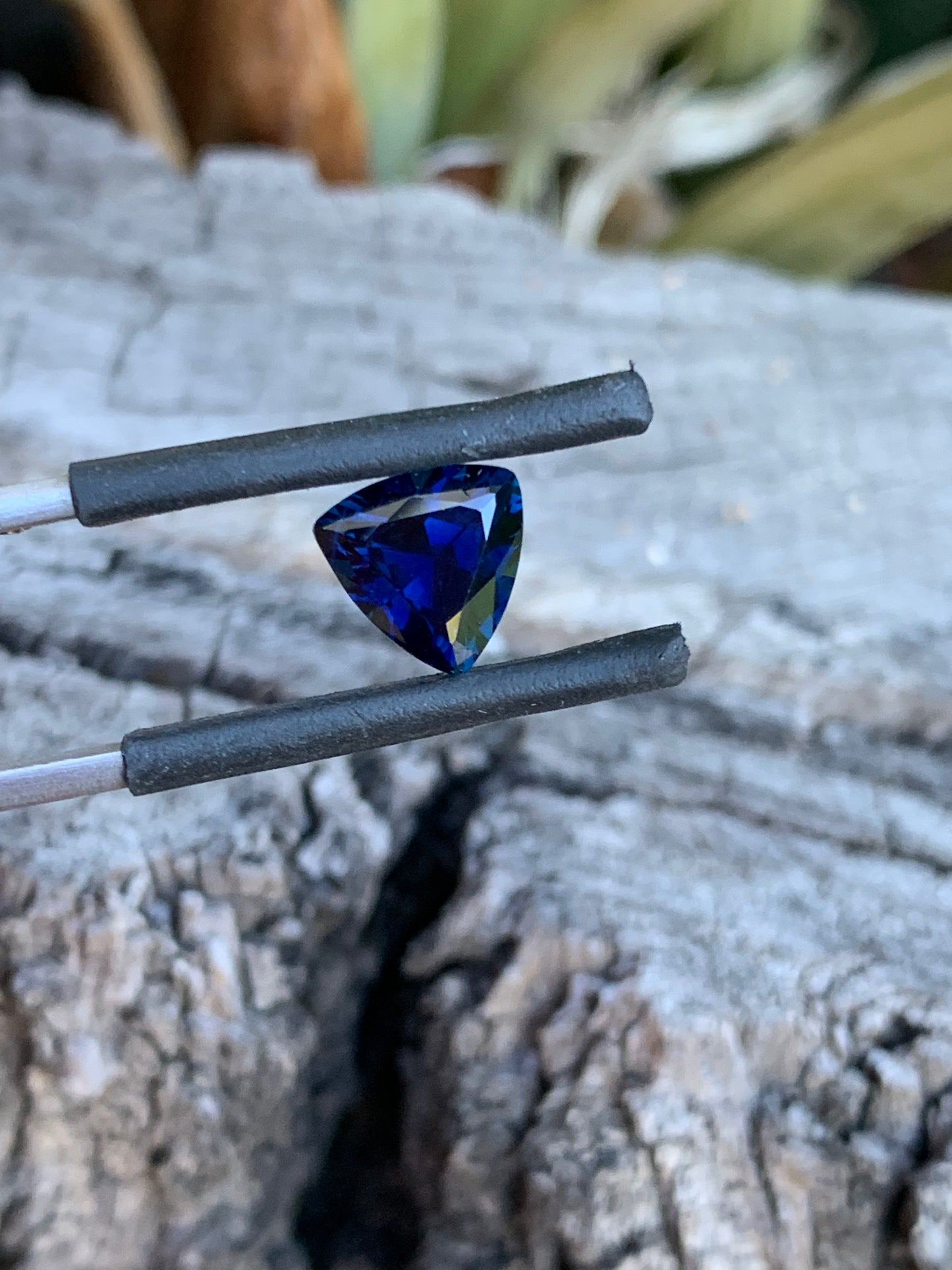 Close-up of a 2.23ct royal blue Australian sapphire in a trillion cut