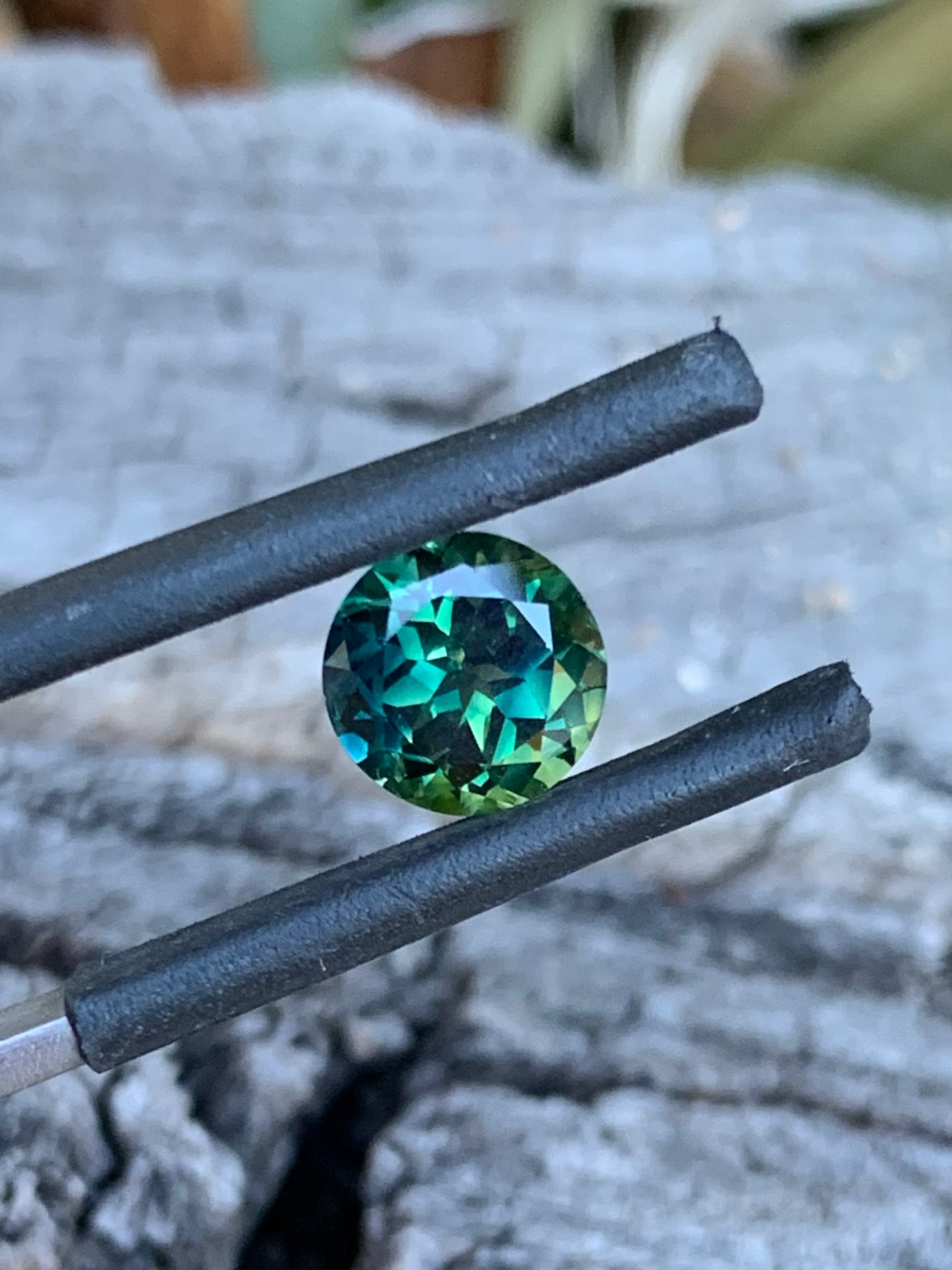 1.96ct teal parti Australian sapphire in a round cut