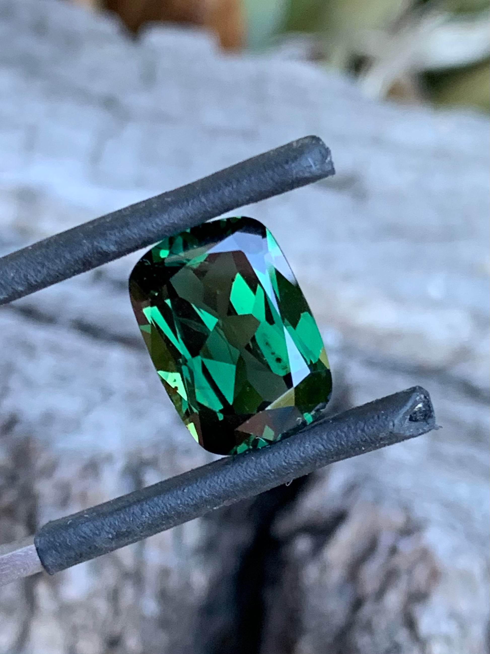 Close-up of 5.82ct deep green sapphire with lush colour