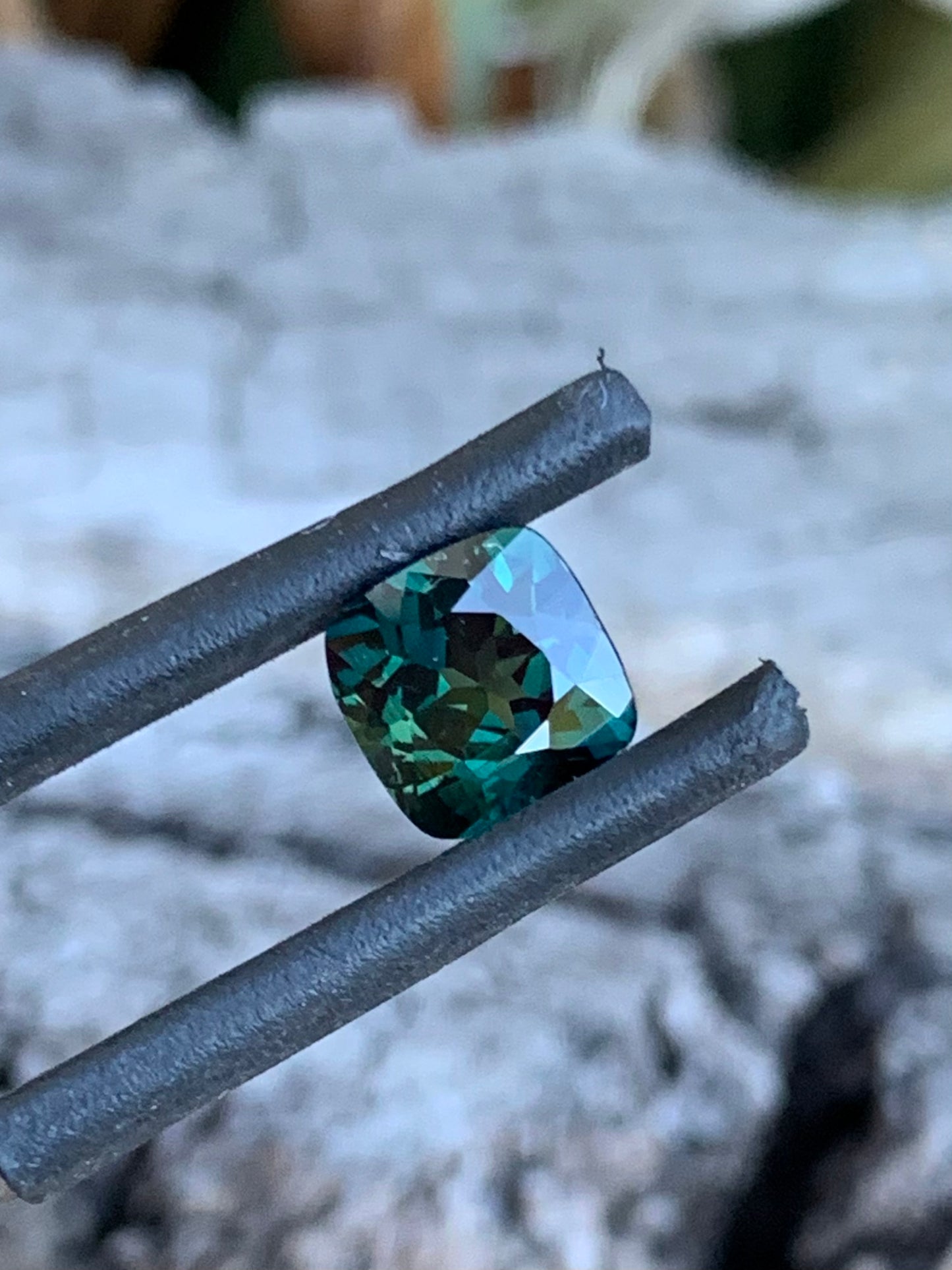 Teal Australian Sapphire in a square cushion cut