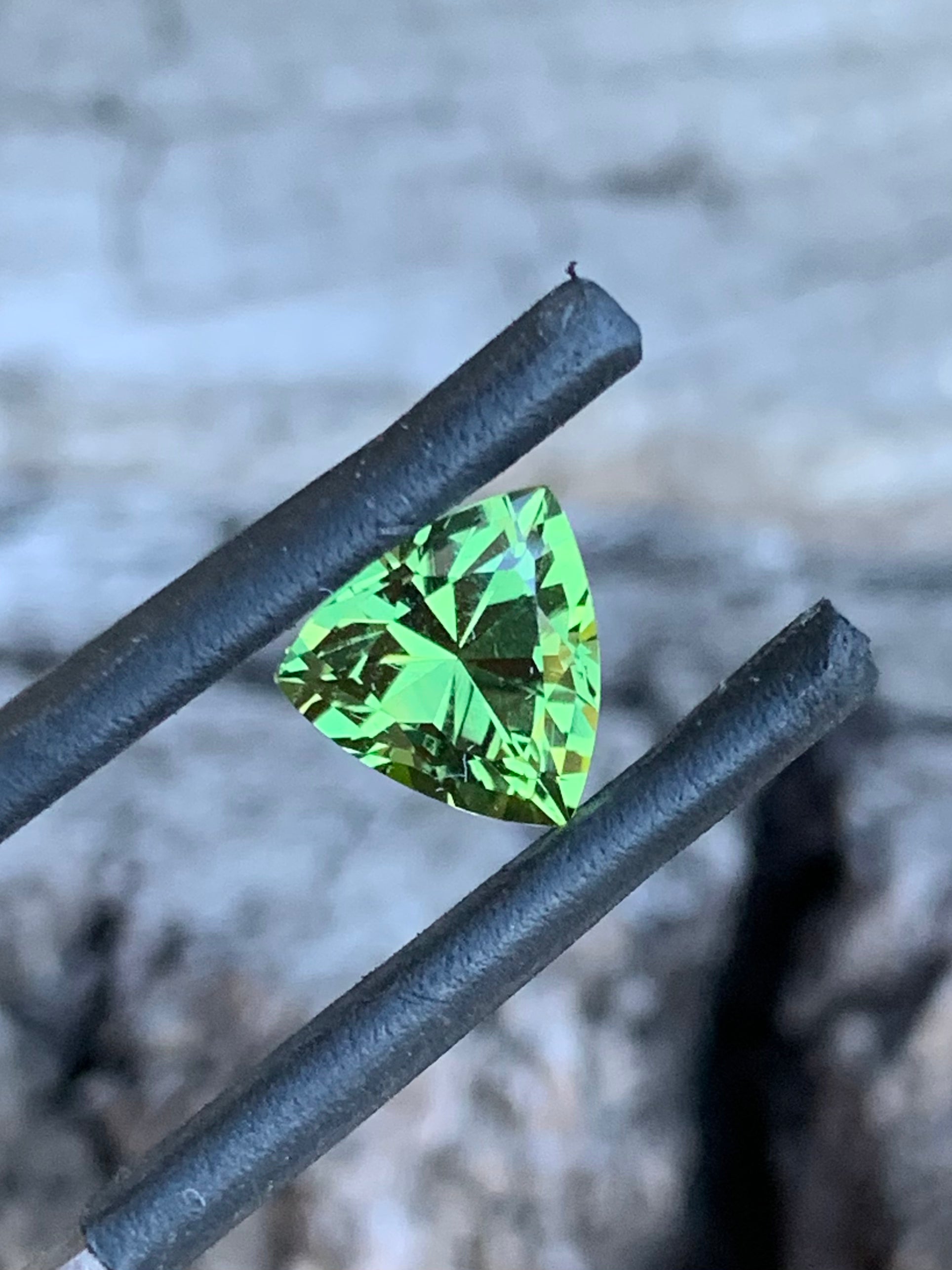 Close-up of 1.86ct light green sapphire showing bright, lively tones