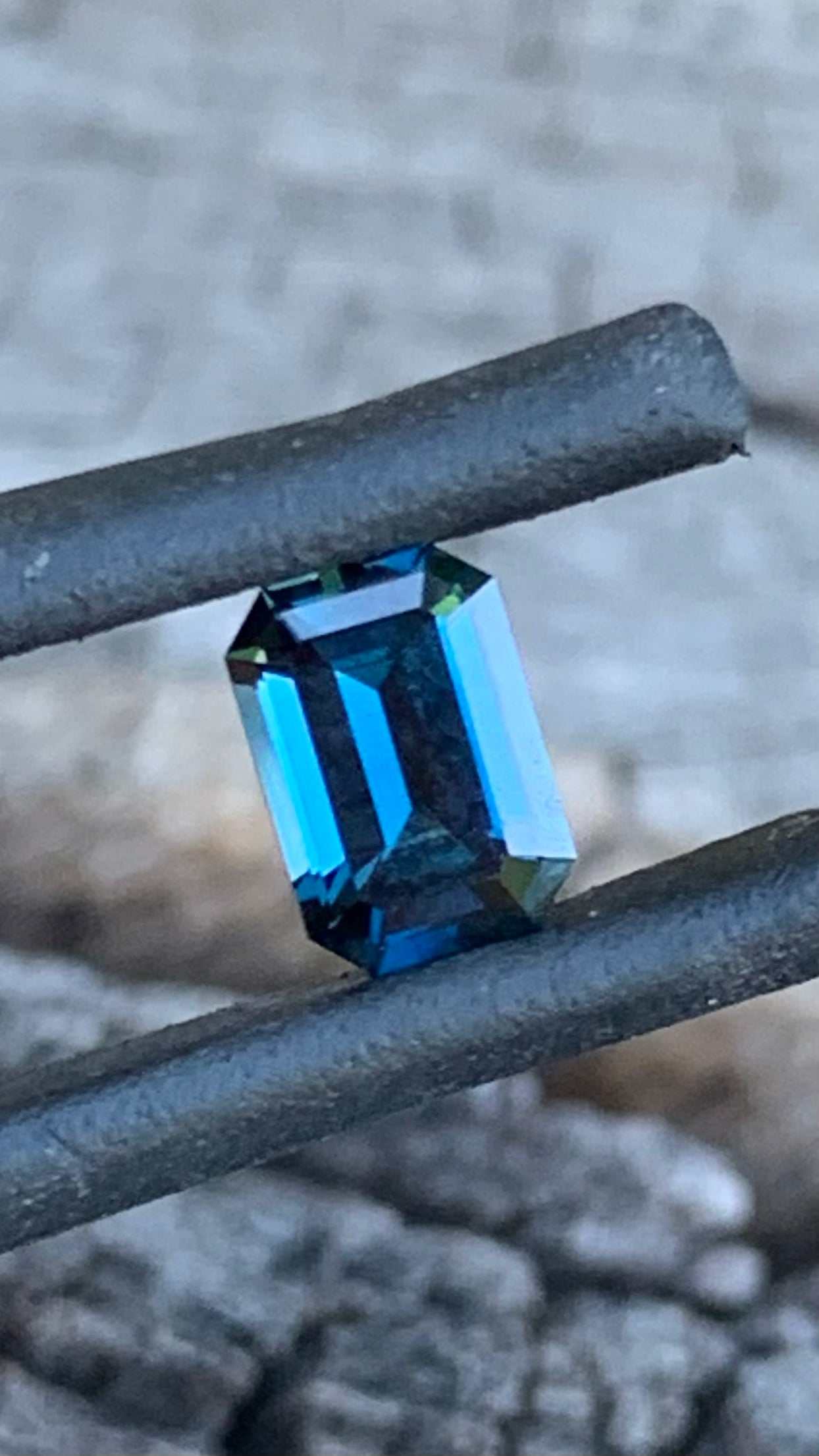 Australian Sapphire cut into an Emerald Cut