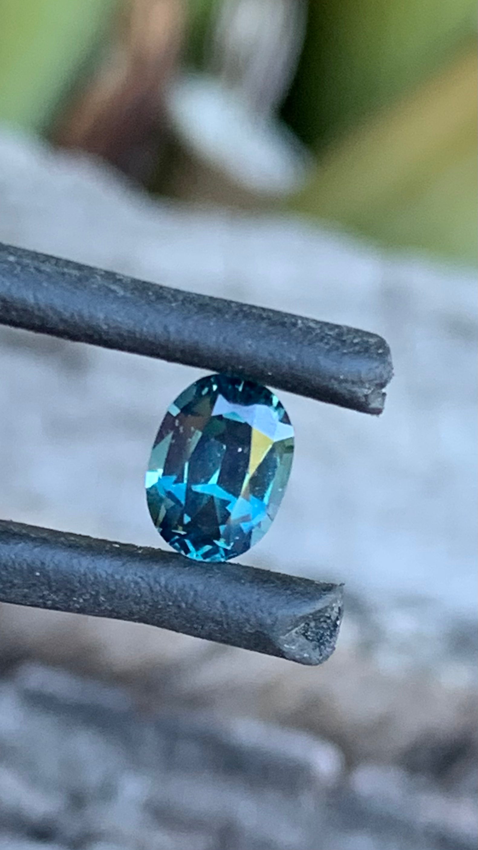 Teal blue Australian sapphire with yellow tones, 0.71ct