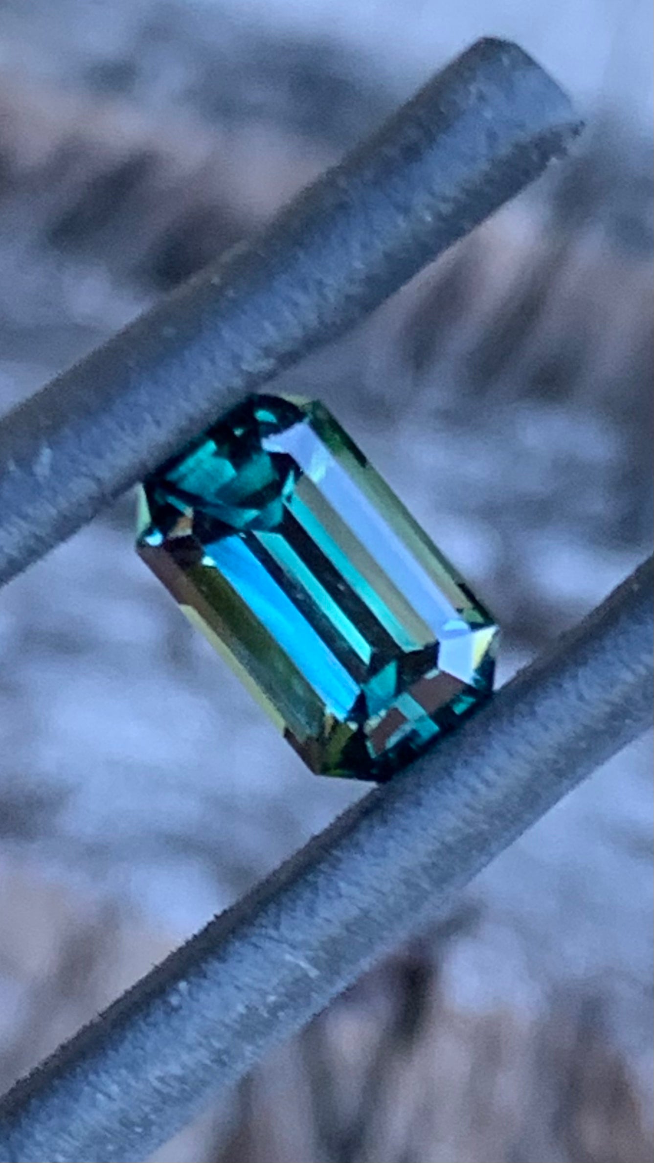 1.09ct emerald cut Australian parti sapphire with teal colour