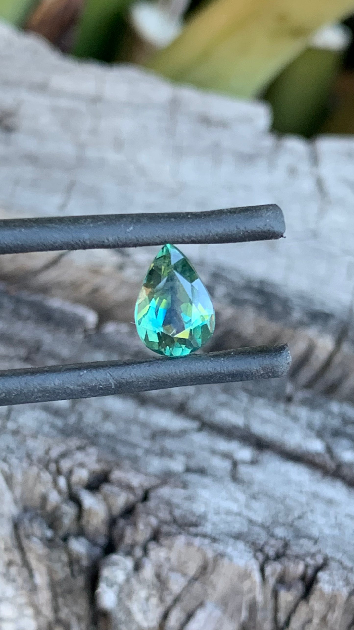 Teal Australian Sapphire cut into a Pear Shape